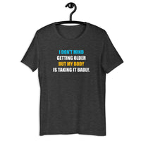 Load image into Gallery viewer, I Don't Mind Getting Older But My Body Is Taking It Badly t-shirt - SHOPNOO
