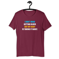 Load image into Gallery viewer, I Don't Mind Getting Older But My Body Is Taking It Badly t-shirt - SHOPNOO
