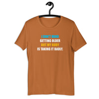 Load image into Gallery viewer, I Don't Mind Getting Older But My Body Is Taking It Badly t-shirt - SHOPNOO
